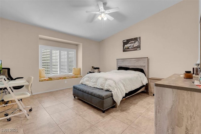 5000 Red Rock St Unit 241, Las Vegas, NV 89118 - bedroom with light tile patterned floors, vaulted ceiling, baseboards, and ceiling fan