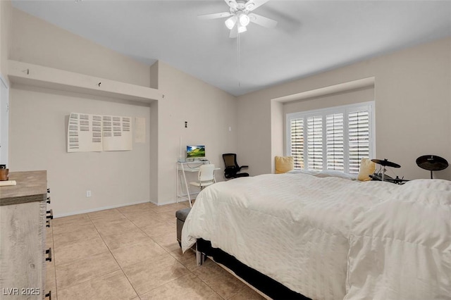 5000 Red Rock St Unit 241, Las Vegas, NV 89118 - bedroom with light tile patterned floors, baseboards, lofted ceiling, and ceiling fan