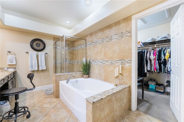 2246 Cassatt Dr, Henderson, NV 89074 - full bath featuring tile patterned floors, a shower stall, a walk in closet, and a garden tub