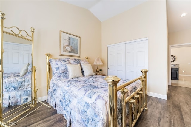 2246 Cassatt Dr, Henderson, NV 89074 - bedroom featuring vaulted ceiling, baseboards, dark wood-type flooring, and a closet