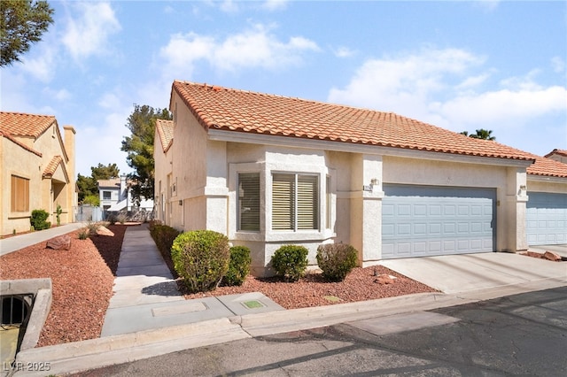 2246 Cassatt Dr, Henderson, NV 89074 - mediterranean / spanish-style house with concrete driveway, a tiled roof, and stucco siding
