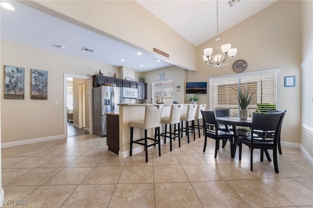 2246 Cassatt Dr, Henderson, NV 89074 - dining room featuring visible vents, baseboards, an inviting chandelier, and light tile patterned flooring