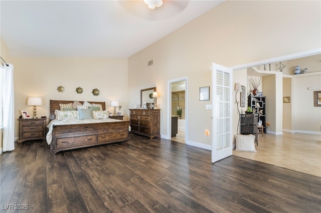 2246 Cassatt Dr, Henderson, NV 89074 - bedroom featuring visible vents, baseboards, high vaulted ceiling, and dark wood finished floors