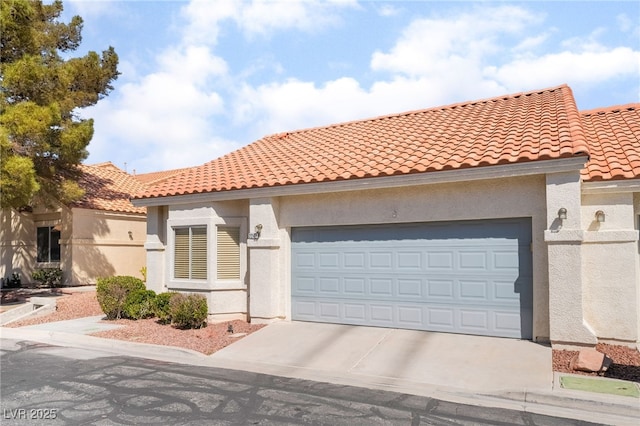 2246 Cassatt Dr, Henderson, NV 89074 - mediterranean / spanish-style home featuring stucco siding, driveway, a tile roof, and an attached garage