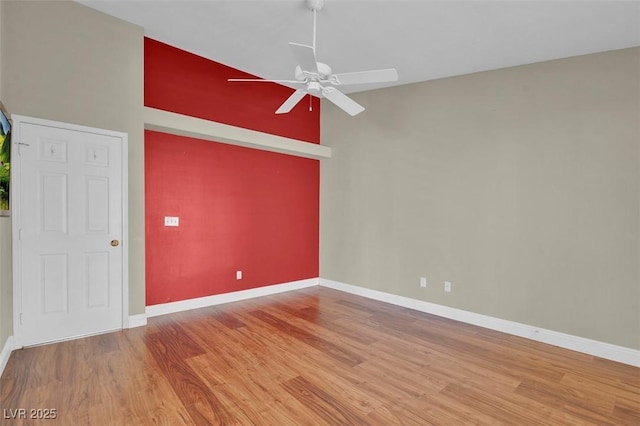 8217 Ashkum Ave, Las Vegas, NV 89149 - unfurnished room featuring a ceiling fan, wood finished floors, and baseboards