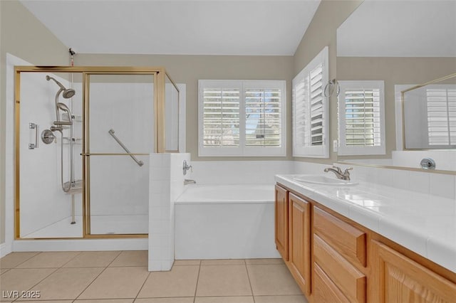 8217 Ashkum Ave, Las Vegas, NV 89149 - full bath with a stall shower, a garden tub, vanity, and tile patterned flooring