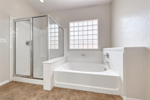 2528 Flodden St, Henderson, NV 89044 - bathroom featuring a shower stall, a bath, and tile patterned floors