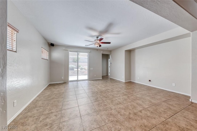 2528 Flodden St, Henderson, NV 89044 - spare room with light tile patterned floors, ceiling fan, and baseboards