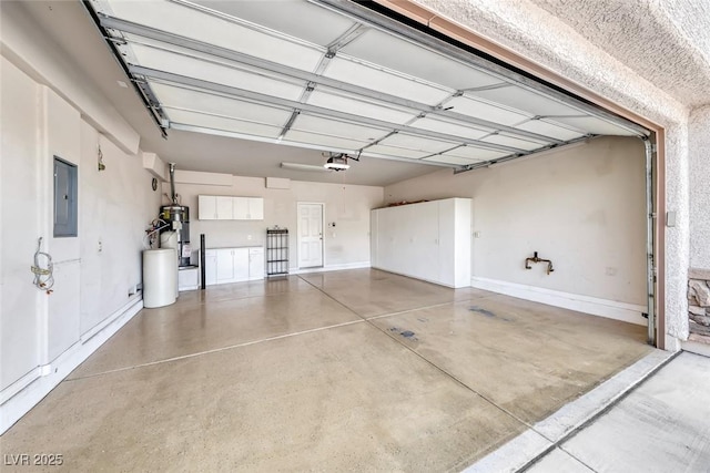 2528 Flodden St, Henderson, NV 89044 - garage with strapped water heater, baseboards, electric panel, and a garage door opener