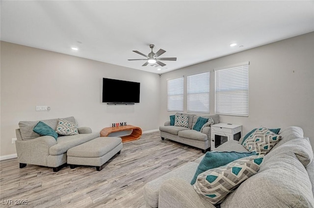 living area with recessed lighting, baseboards, light wood-type flooring, and ceiling fan