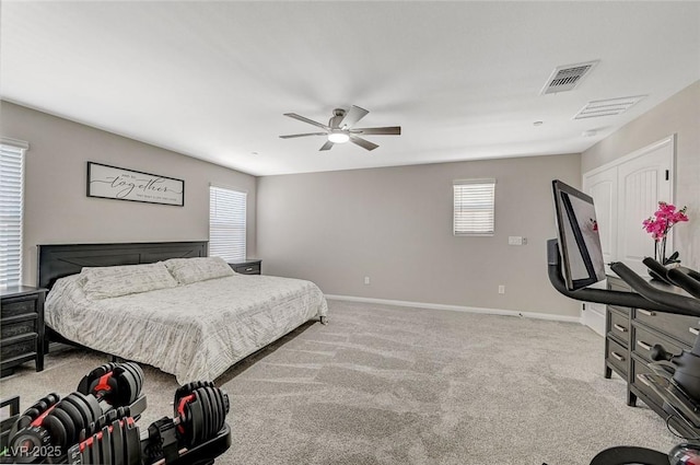 bedroom with a ceiling fan, carpet, visible vents, and baseboards