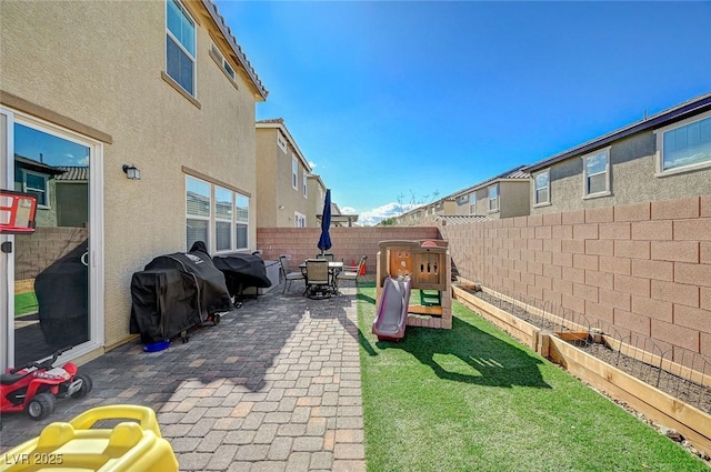 view of yard with a fenced backyard and a patio