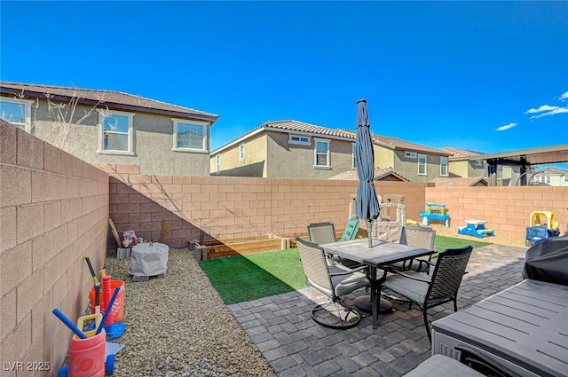 view of patio / terrace with a fenced backyard and outdoor dining space