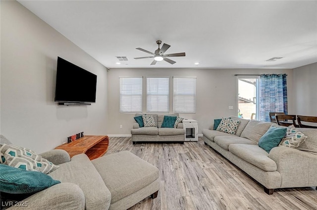 living room featuring baseboards, visible vents, recessed lighting, ceiling fan, and light wood-style floors
