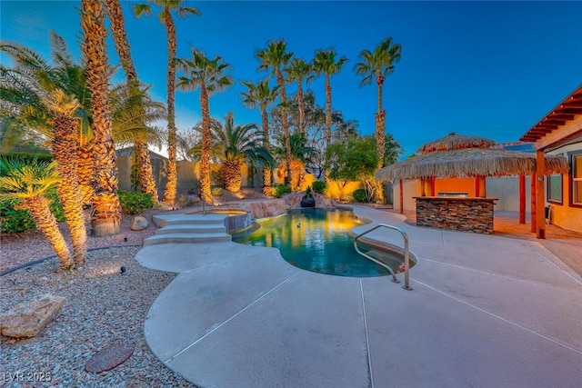 view of pool featuring a fenced in pool, a patio, and outdoor dry bar