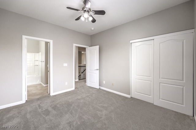 unfurnished bedroom featuring carpet floors, a closet, baseboards, and ceiling fan