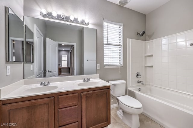 full bathroom with toilet, tub / shower combination, double vanity, tile patterned floors, and baseboards