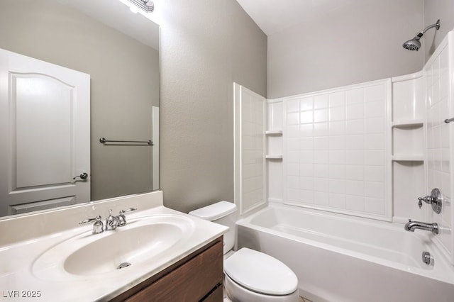 bathroom with toilet, vanity, and washtub / shower combination