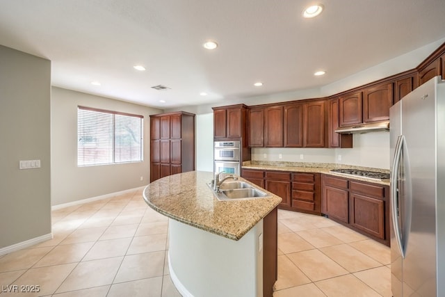 kitchen featuring appliances with stainless steel finishes, a sink, under cabinet range hood, recessed lighting, and light tile patterned floors