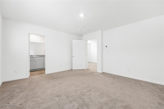 4125 Venus Falls Ave, North Las Vegas, NV 89084 - spare room with light colored carpet and baseboards