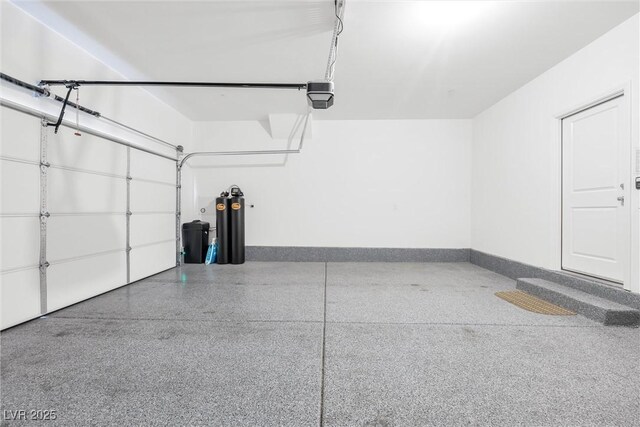 4125 Venus Falls Ave, North Las Vegas, NV 89084 - garage with a garage door opener and baseboards