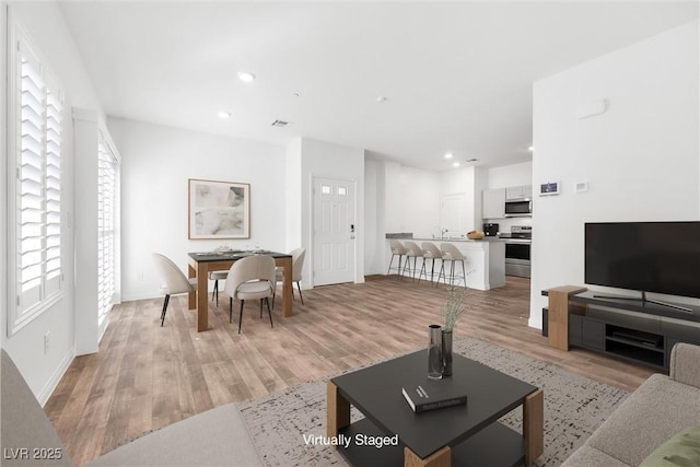 4125 Venus Falls Ave, North Las Vegas, NV 89084 - living area featuring light wood-type flooring and recessed lighting