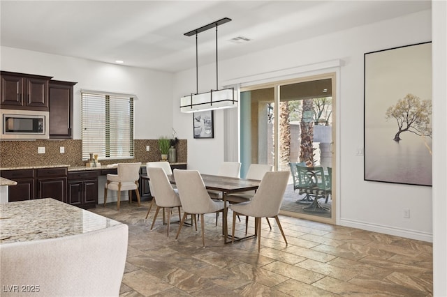 50 Carolina Cherry Dr, Las Vegas, NV 89141 - dining space featuring stone tile floors and recessed lighting