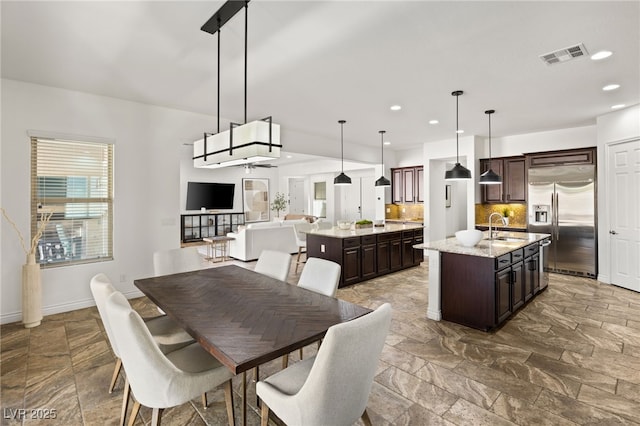 50 Carolina Cherry Dr, Las Vegas, NV 89141 - dining area with stone tile floors, recessed lighting, and a ceiling fan