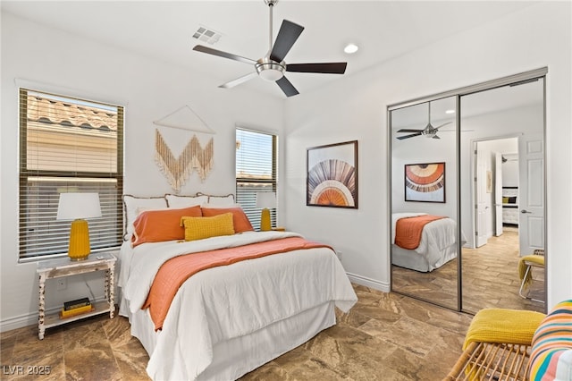 50 Carolina Cherry Dr, Las Vegas, NV 89141 - bedroom with a closet, ceiling fan, stone finish floors, and recessed lighting