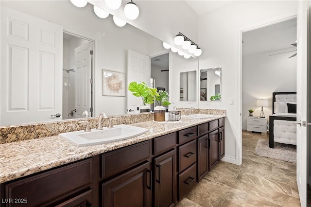 50 Carolina Cherry Dr, Las Vegas, NV 89141 - ensuite bathroom with double vanity and baseboards