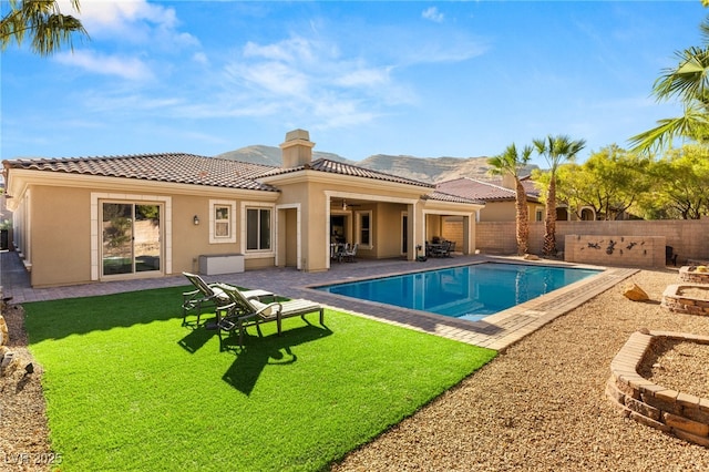50 Carolina Cherry Dr, Las Vegas, NV 89141 - rear view of property with a tiled roof, a fenced backyard, stucco siding, and a patio