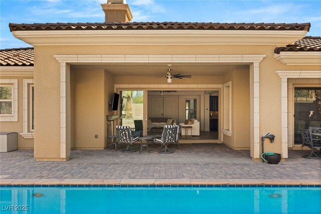 50 Carolina Cherry Dr, Las Vegas, NV 89141 - outdoor pool with a ceiling fan, a patio area, and an outdoor hangout area