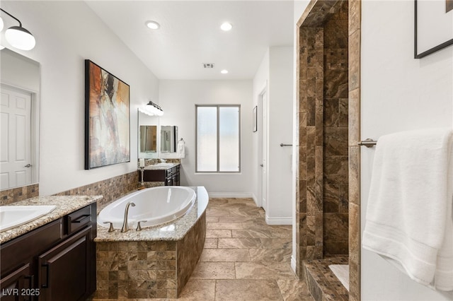 50 Carolina Cherry Dr, Las Vegas, NV 89141 - full bathroom with a bath, two vanities, tiled shower, recessed lighting, and stone tile flooring