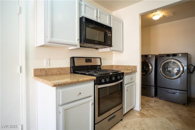 8160 Autumn Star Ave, Las Vegas, NV 89145 - kitchen featuring black microwave, separate washer and dryer, stainless steel gas range, and white cabinets