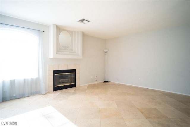 8160 Autumn Star Ave, Las Vegas, NV 89145 - unfurnished living room with visible vents, baseboards, and a tile fireplace