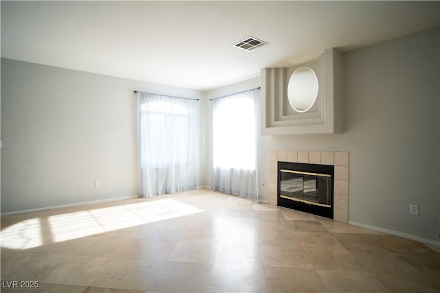 8160 Autumn Star Ave, Las Vegas, NV 89145 - unfurnished living room with baseboards, a tile fireplace, and visible vents