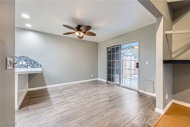 unfurnished room with ceiling fan, baseboards, wood finished floors, and recessed lighting