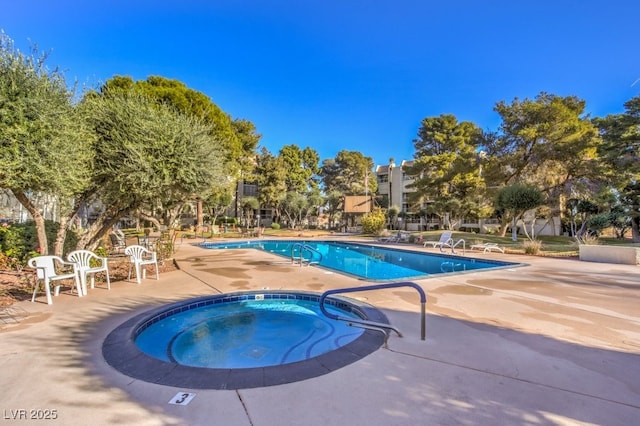 725 N Royal Crest Cir Unit 227, Las Vegas, NV 89169 - community pool with a community hot tub and a patio
