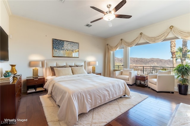 380 Claremont St, Boulder City, NV 89005 - bedroom featuring wood-type flooring, crown molding, a mountain view, and visible vents