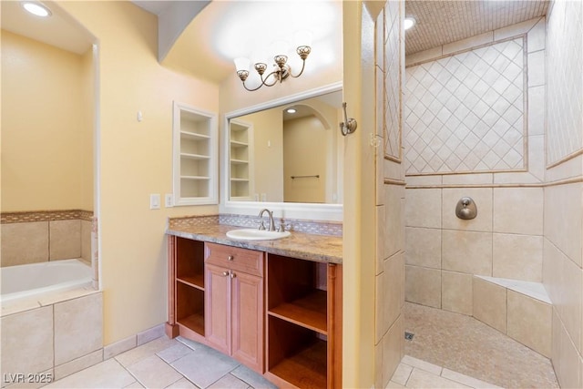 26 Via Vasari Unit 204, Henderson, NV 89011 - full bath with vanity, a garden tub, tile patterned floors, built in shelves, and recessed lighting