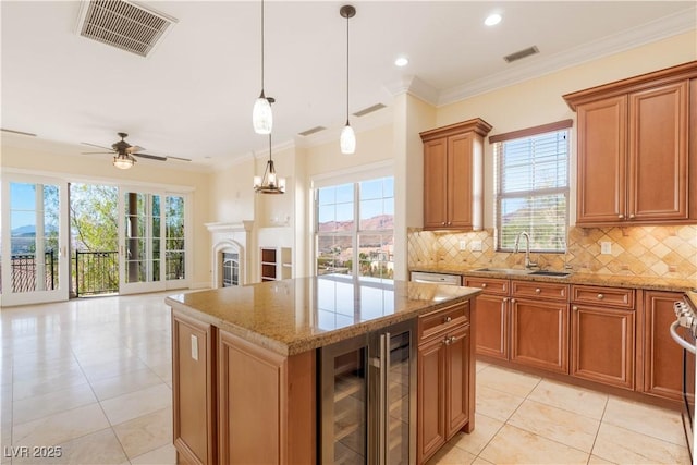 26 Via Vasari Unit 204, Henderson, NV 89011 - kitchen with beverage cooler, brown cabinetry, light tile patterned flooring, a ceiling fan, and decorative backsplash