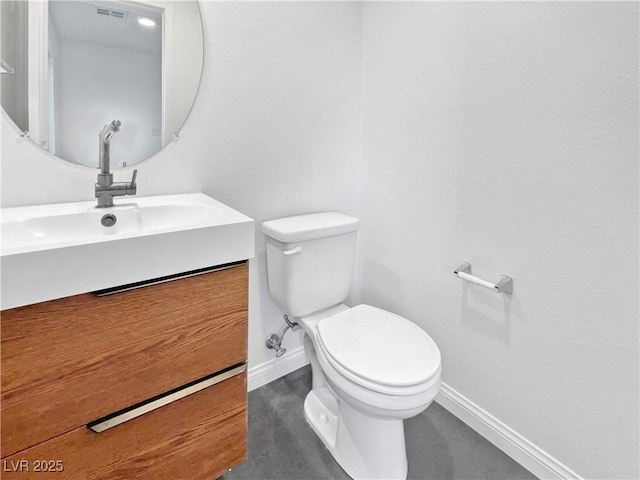 10537 Headwind Ave, Las Vegas, NV 89129 - bathroom featuring toilet, baseboards, and vanity