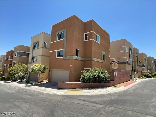 10537 Headwind Ave, Las Vegas, NV 89129 - view of property with a garage and a residential view