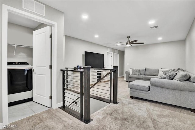 carpeted living area with visible vents, a ceiling fan, and recessed lighting