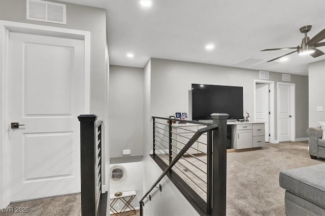 interior space featuring light carpet, recessed lighting, visible vents, and ceiling fan