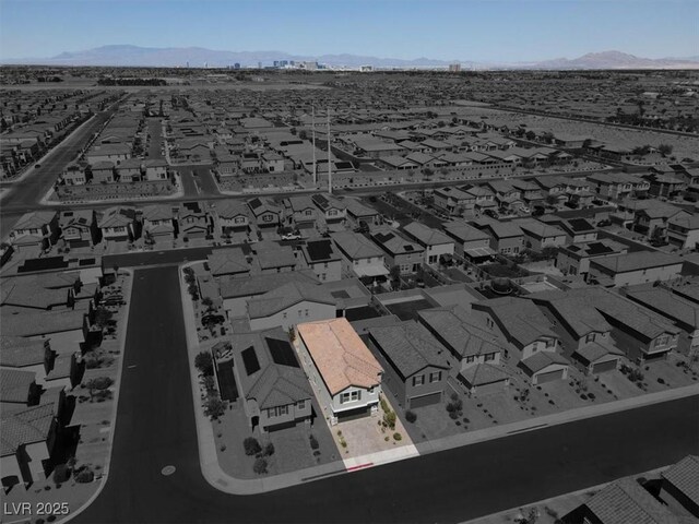 drone / aerial view featuring a mountain view and a residential view