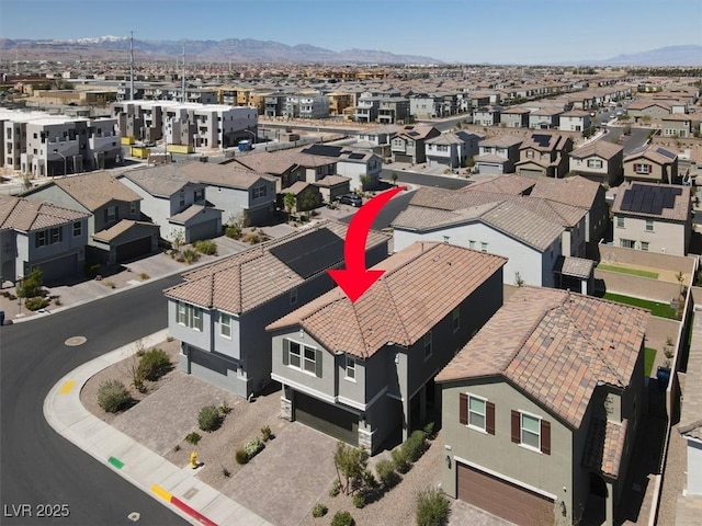 aerial view featuring a residential view and a mountain view