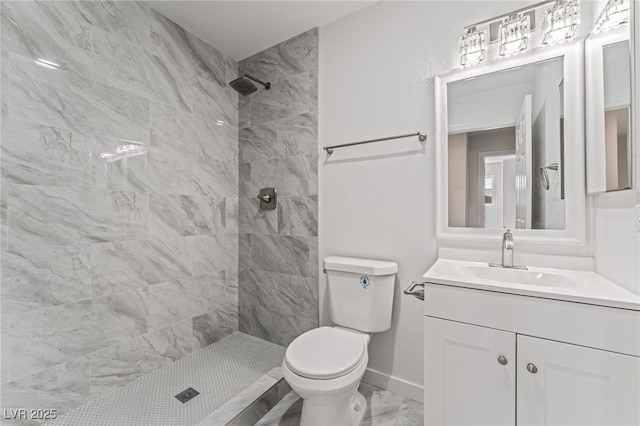 2915 Cedar Ave Unit 12C, Las Vegas, NV 89101 - full bathroom with baseboards, toilet, tiled shower, marble finish floor, and vanity
