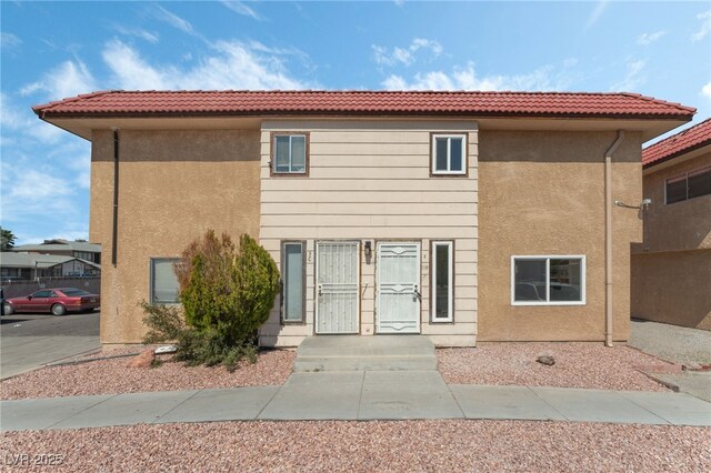 2915 Cedar Ave Unit 12C, Las Vegas, NV 89101 - view of front facade with stucco siding and a tile roof