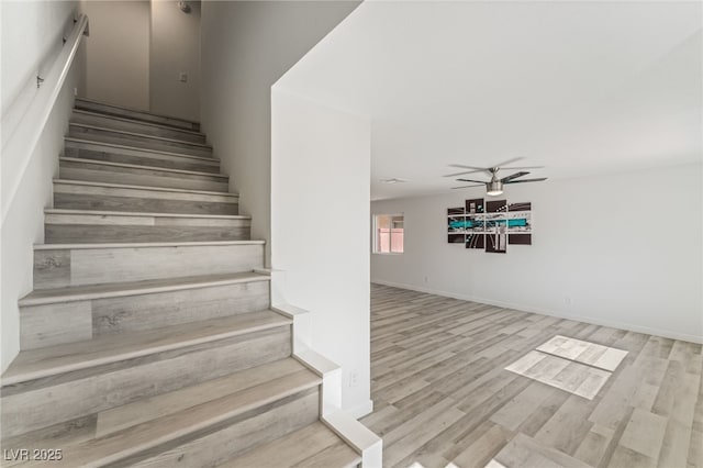 2915 Cedar Ave Unit 12C, Las Vegas, NV 89101 - stairs featuring baseboards, a ceiling fan, and wood finished floors